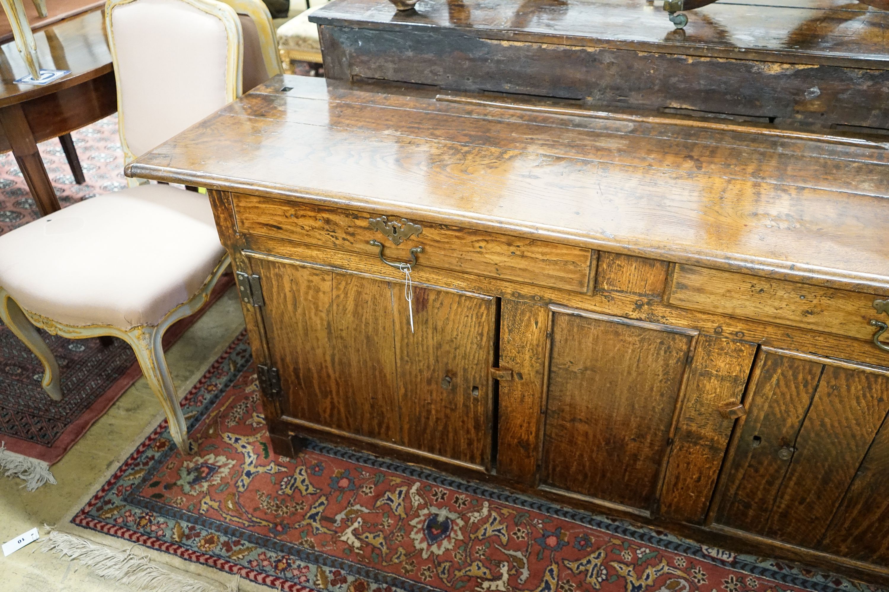 An 18th century and later oak low dresser, length 182cm, depth 52cm, height 75cm